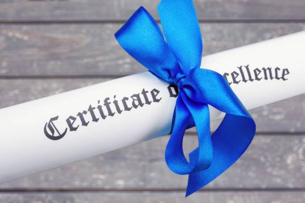 Diploma tied with blue ribbon  on background